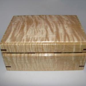 Small Tiger Maple Box Upholstered In Dark Brown..